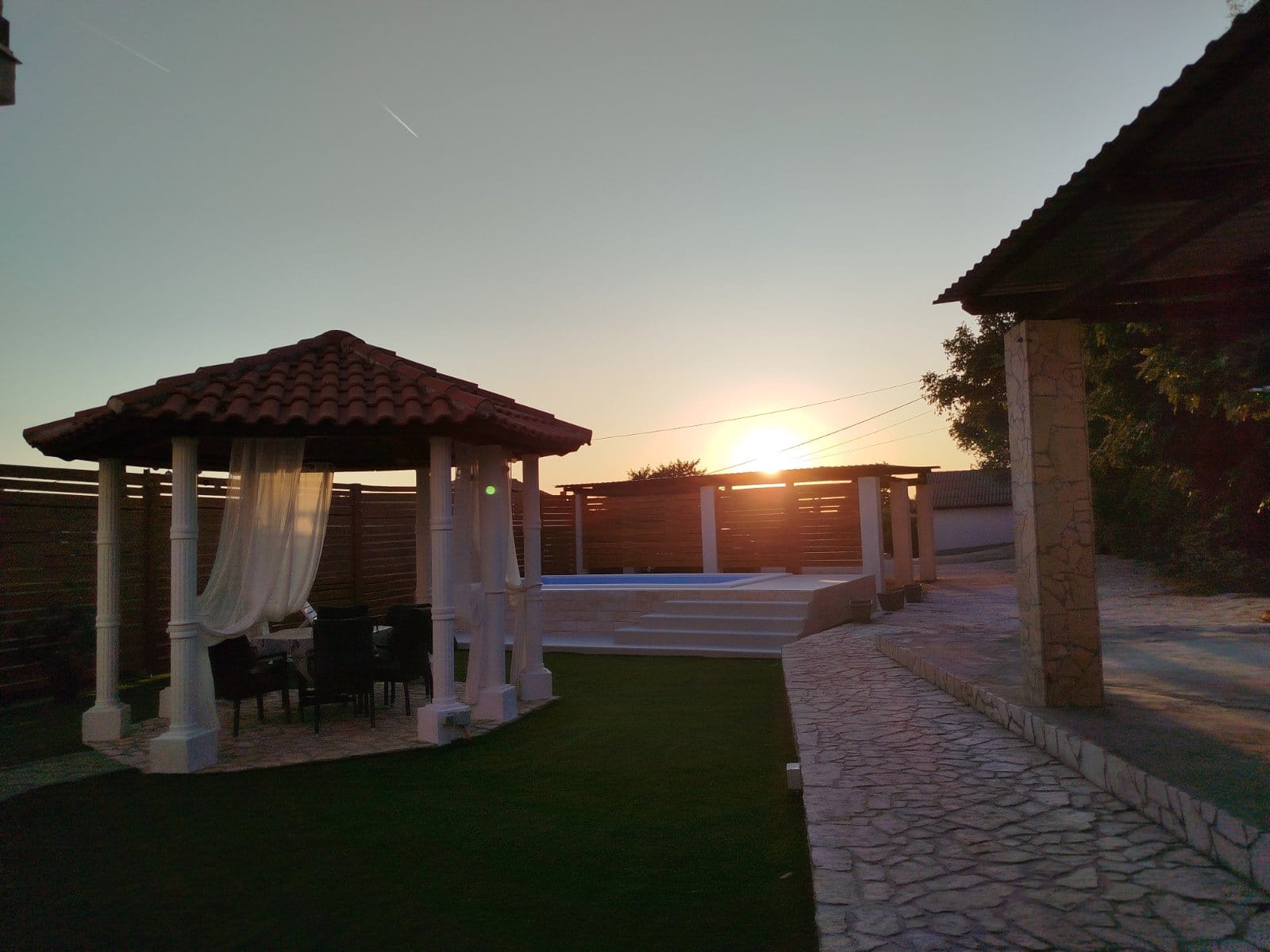 House Golubovac Apartmani Rab house exterior in Kampor at sunset